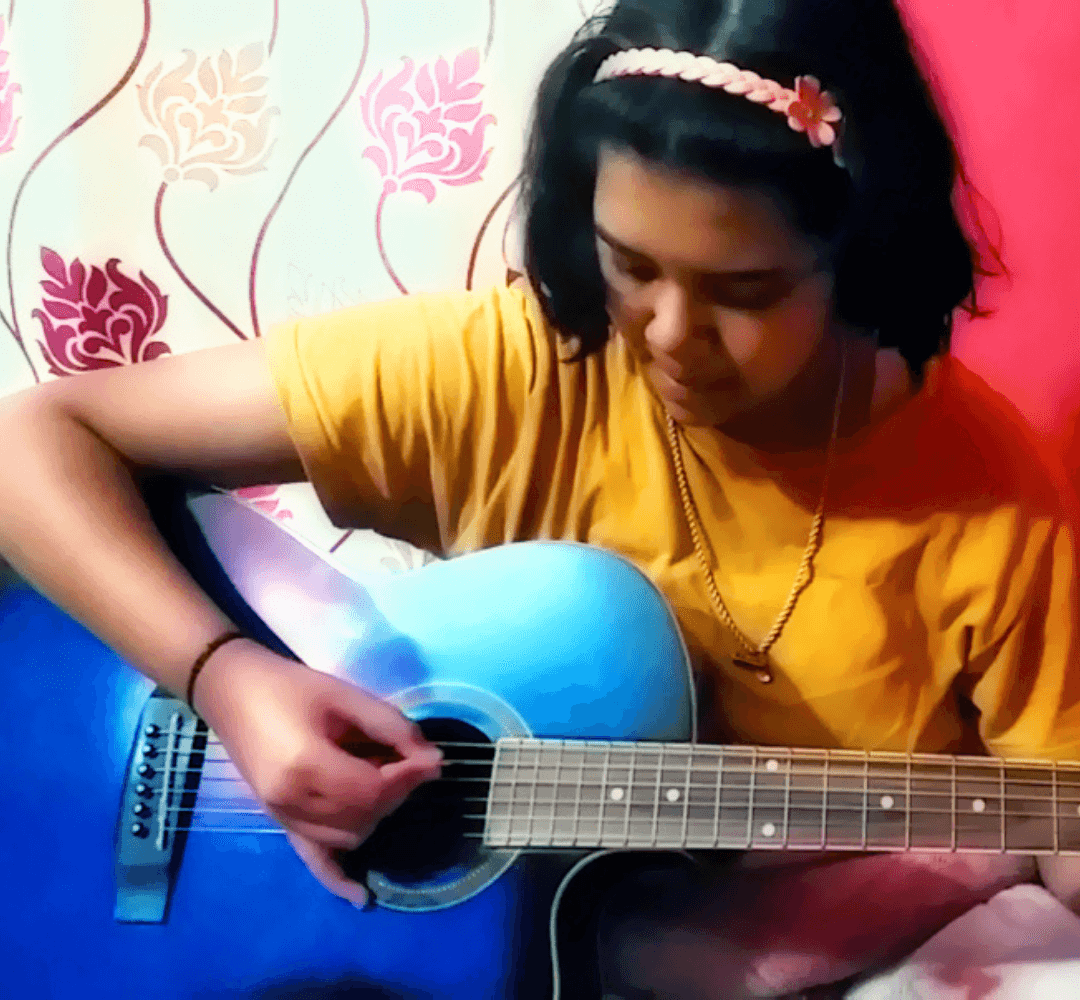 Ananya Nandi Playing Guitar