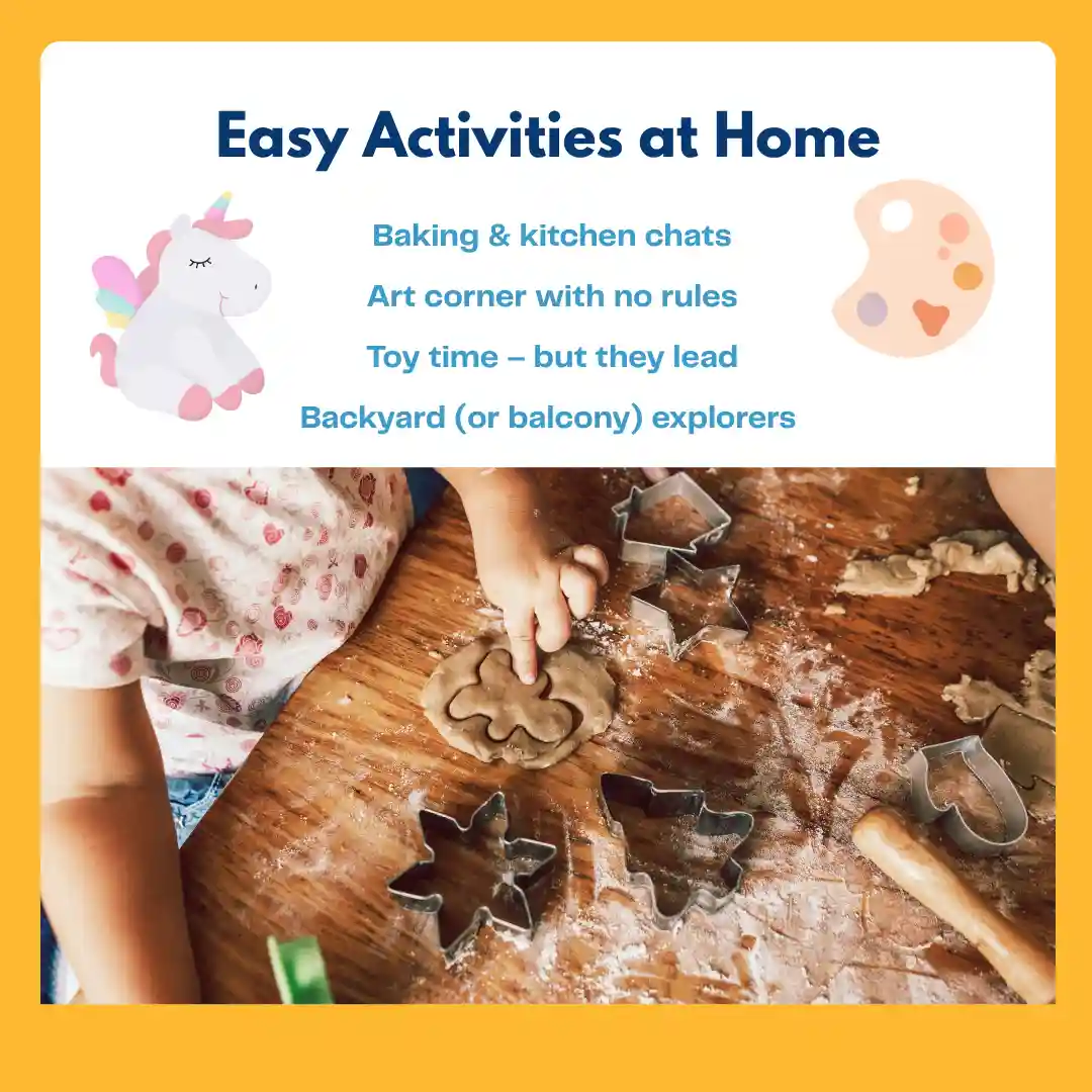 A child presses dough on a flour-covered wooden table using cookie cutters shaped like stars and animals. A rolling pin and other baking tools are scattered around.
